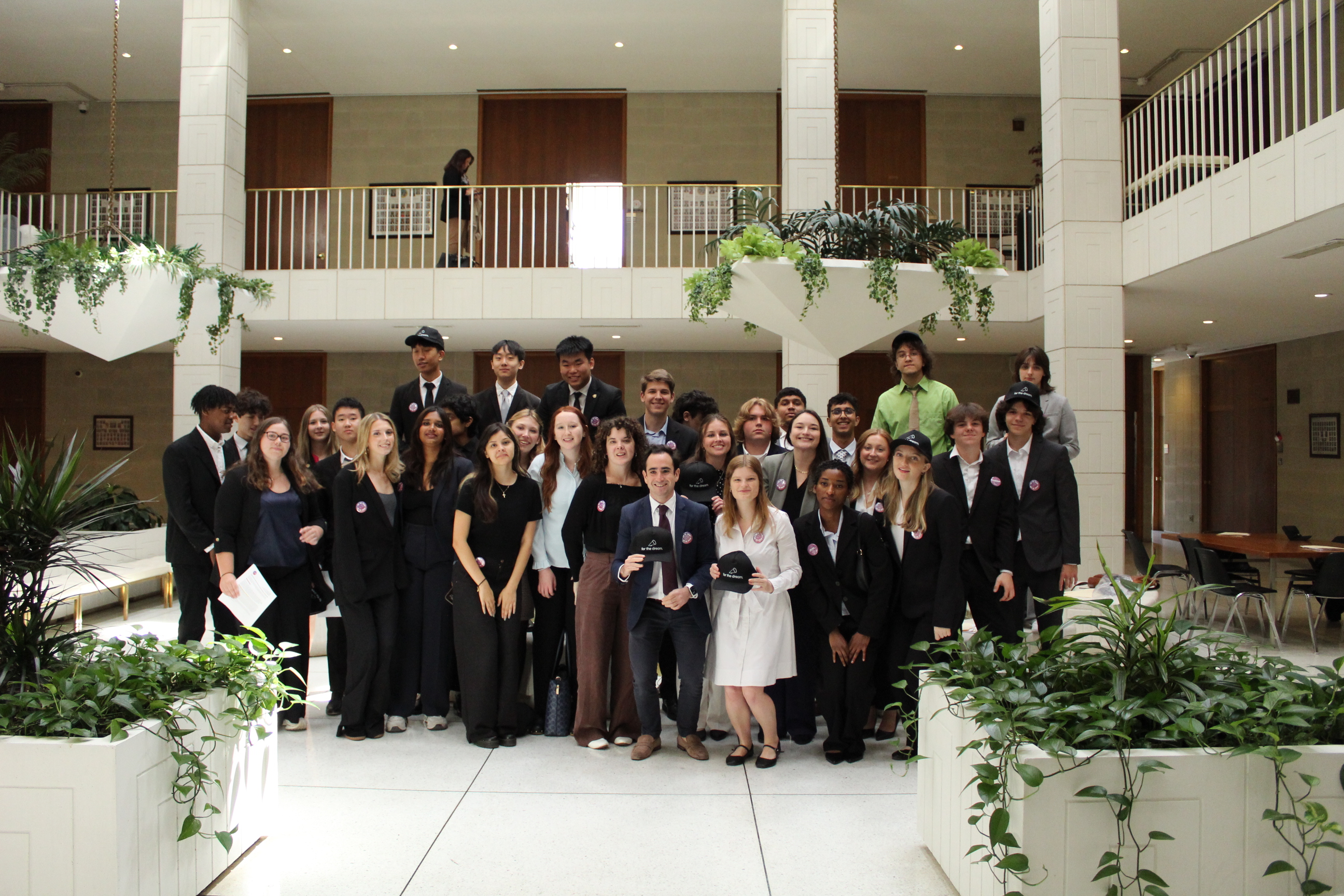 Young People's Alliance members at a lobby day event in a legislative building
